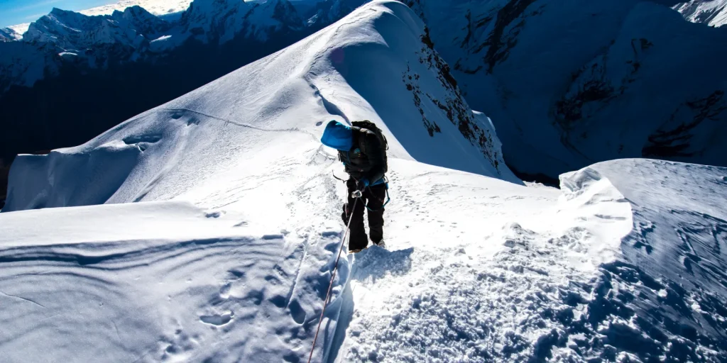 Snow View Trek 26 person climbing on the summit of Mera Peak in high